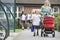 A woman with a pushchair with her son