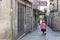 A woman pushes a shopping cart in Pontevedra Spain