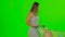 Woman pushing a cart with food. Green screen