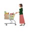 Woman pushing a full shopping cart