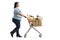 Woman pushing a shopping cart filled with groceries
