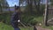 Woman pushing wheelbarrow in garden