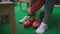 Woman put on ice skates sitting bench