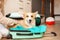 woman Puts corgi dog, puppy, into suitcase. Preparation for trip