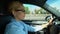 Woman puts on glasses while driving, blurred vision and risk of car accident