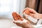 A woman puts on the hands of cosmetics from a bottle or liquid natural soap. Body care concept