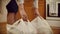 Woman puts packages on floor. Close-up of women`s hands put on floor heavy bags of food at home. Food purchases for home