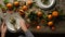 Woman puts plate with napkin on Christmas table.