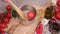 woman puts tomato to pot with hot boiling water for blanching