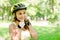 Woman putting biking helmet on outside during bicycle ride