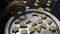 Woman putting fresh biscuits in baking dish. Christmas cookies.