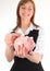 Woman putting money in a Piggy Bank