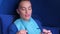 Woman putting on protective glasses before LED teeth whitening in dentistry.