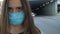 Woman putting safety mask on city street, environmental pollution, epidemic