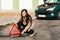 Woman putting warning triangle on the road