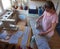 Woman in quarantine sews for other protective masks