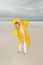 Woman raincoat autumn storm at beach