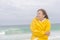 Woman raincoat autumn weather at beach