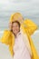 Woman raincoat seasonal storm at beach