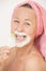 Woman with razor shaving face