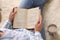 Woman reading book on fuzzy rug