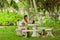 A woman reading a book in the garden