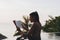 Woman reading a book in the swimming pool