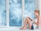 Woman reading book in warm room