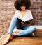 Woman reading books, story and study at home for relaxed learning, studying and education. College student, young black