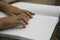 Woman reading Braille book