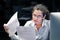 Woman reading a document in office workspace