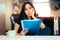 Woman Reading Important Documents in a Restaurant