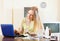 Woman reading about medications on laptop in internet