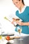 Woman reading recipe cooking book kitchen salad
