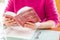 Woman reading Red Michelin guide book which reviews restaurants