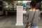 Woman reading safety signs at Bonifacio High street, Makati city, Metro Manila , Philippines, Dec 8, 2020