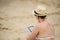 woman reading tablet reader on the beach