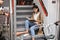 Woman reads book on train stairs