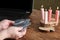 a woman reads cards in front of a computer, candles, a laptop, playing cards,, fortune telling on the Internet