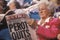 Woman reads Perot Quits