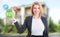 Woman real estate agent holding buy, sell and rent offers