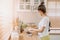 Woman rearrange equipments items and cleaning the kitchen.