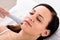 Woman Receiving Face Massage From Therapist