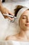 Woman receiving oxygen mesotherapy on her face,