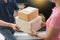 Woman receiving parcel cardboard box from delivery man Carrying