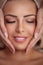 Woman receiving professional face massage