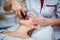 Woman receiving ultrasonic facial exfoliation at cosmetology salon.