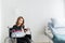 The woman recovered from the injury, sitting on a wheelchair in the patient`s room