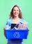 Woman with a recycle bin