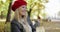 Woman in red beret relaxing on bench
